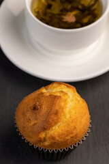Soft and fresh fragrant wheat cupcake on a black stone