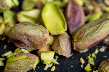 Crispy delicious pistachios with salt on the table