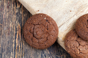chocolate cookies on a wooden board