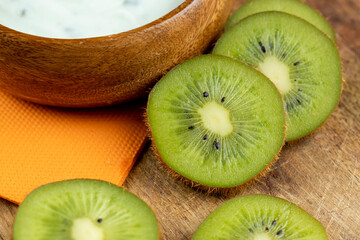 fresh green kiwi while cooking food in the kitchen