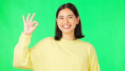 Ok, green screen and portrait of woman doing a perfect sign or hand gesture isolated in a studio...