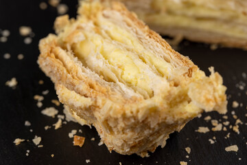 delicious piece of cake with puff pastry and sweet cream