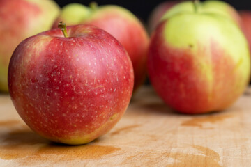 Fresh red and green apples on the kitchen table