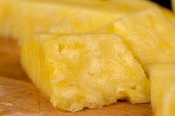 ripe yellow pineapple cut into pieces