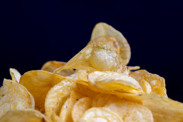 thin potato chips with spices, close up