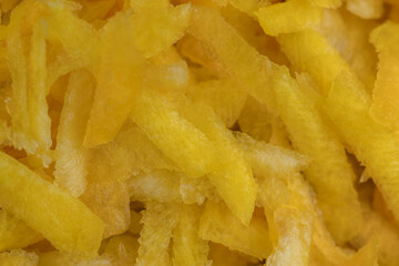 Finely grated yellow carrots in the kitchen
