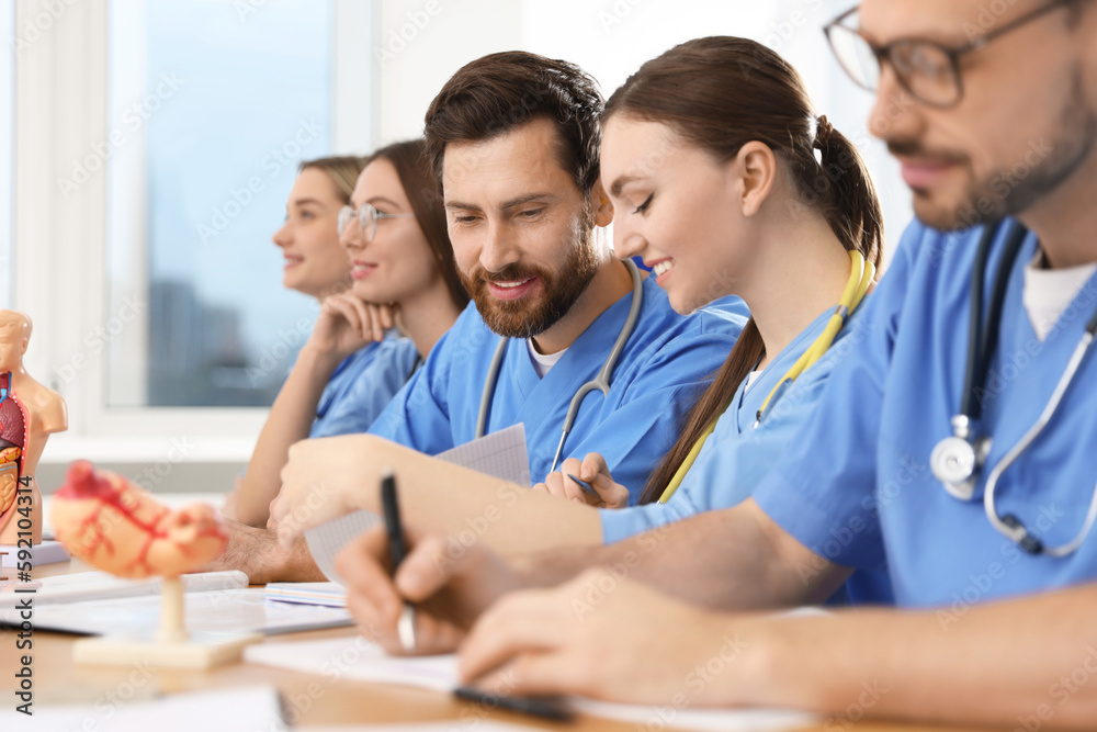 Sticker Medical students in uniforms studying at university