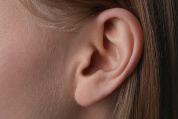 Closeup view of woman, focus on ear