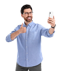 Smiling man taking selfie with smartphone and showing thumbs up on white background
