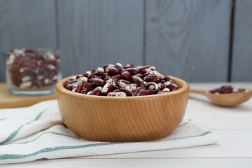 Bowl with dry kidney beans on white table