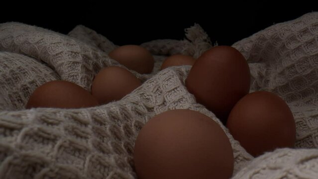 Macro Shot Of Fresh Brown Eggs On Rough Cloth.