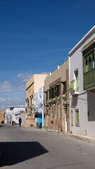 Fototapeta na wymiar Buildings with balconies around the Great Mosque in Kairouan, Tunisia