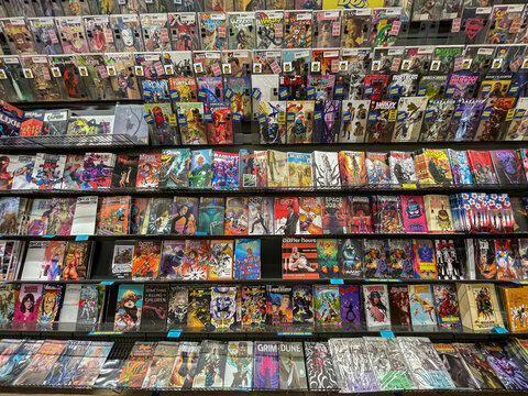 Variety of comic book titles available for sale at Midtown Comics store in Manhattan.