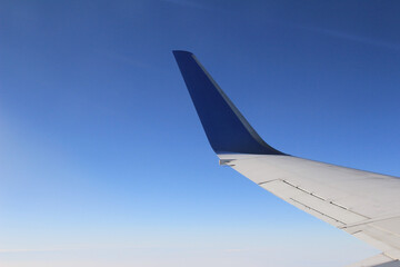  Wing of the plane on sky background