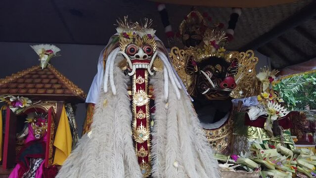 Barong and Celuluk Masks in Balinese Hindu Temple, Offerings, Flowers, Characters from Calonarang Dance Drama