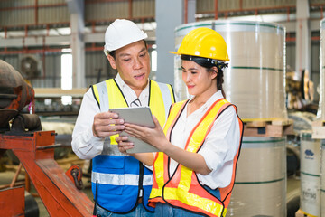 Professional industry engineer worker in a metal manufacture warehouse , maintenance service check for safety first concept .