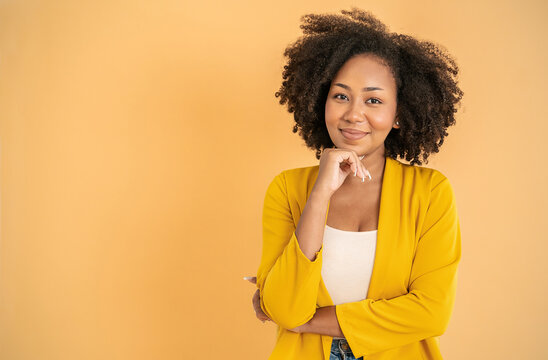 Portrait smile confident business designer black woman yellow suit office. Black business girl Startup successful power business leader women executive people looking copy space isolated on yellow