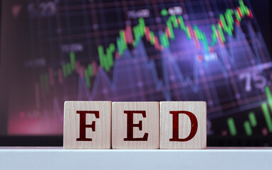 FED - acronym from wooden blocks with letters, The Federal Reserve. Financial market concept
