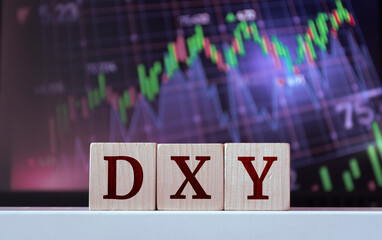 DXY - acronym from wooden blocks with letters. The rise and fall of the dollar currency index, Financial market concept