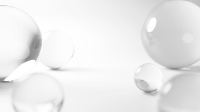 白背景に透明な球体のガラス。美白、スキンケア、化粧品の背景イメージ。（横長）