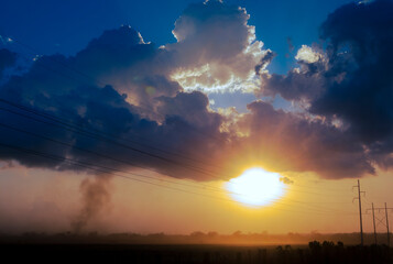Obraz premium Panoramic view of sunset in rural Guatemala in Central America, sunset and clouds in the sky, sugar cane fields.