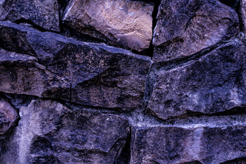 The texture of the wall is arranged with stones.