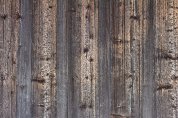 Old wooden background darkened by time.