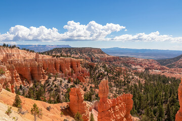 Scenic aerial view of Boat Mesa and massive hoodoo wall sandstone rock formation on Fairyland hiking trail in Bryce Canyon National Park, Utah, USA. Unique nature in barren landscape. Clouds emerging