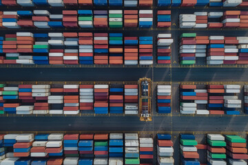 Fototapeta premium stacked freight shipping containers, cargo port, cargo terminal, shipping terminal, aerial view - Generative AI