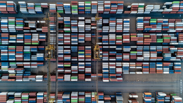 stacked freight shipping containers, cargo port, cargo terminal, shipping terminal, aerial view - Generative AI