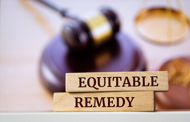 Wooden blocks with words 'Equitable remedy'.