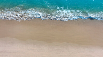 Fototapeta na wymiar Aerial view with beach in wave of turquoise sea water shot, Top view of beautiful white sand background
