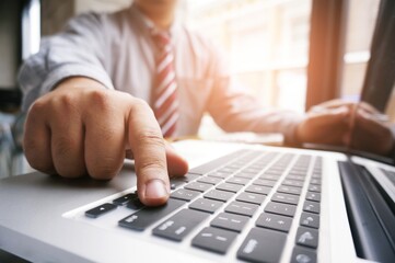Hands of business people typing on a keyboard, chatting online.