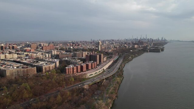 Manhattan skyline and Hudson River from Washington Heights. Good aerial view of cars heading downtown along the west side highway. Evening lighting. 4K