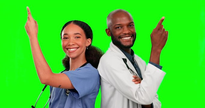 Green screen, nurse and doctor pointing up to mockup in studio isolated on a background. Face portrait, medical teamwork and happy woman and black man with product placement, advertising or marketing