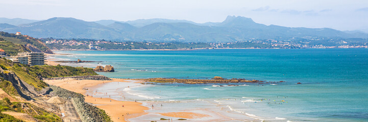 Basque coastline with a view on the mountains of the Pyrenees on a summer day in Biarritz, France © JeanLuc Ichard