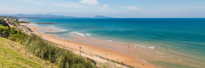 Panorama of Cote des Basques beach in Biarritz, France on a summer day - obrazy, fototapety, plakaty