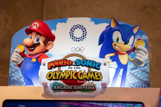 mario nintendo and sonic sega at the olympic games in arcade edition with logo text sign brand on sport game