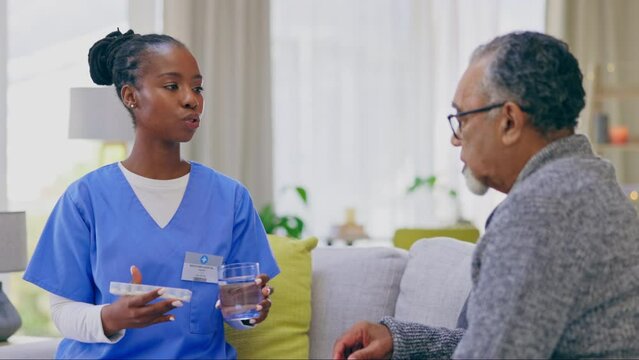 Senior man, nurse and explain with pills in house for retirement, wellness and health advice talk. Nursing home, black woman and elderly male with medicine, consulting and chat for healthcare service