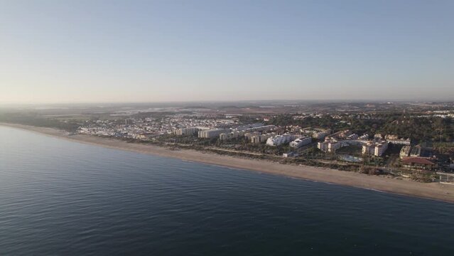 Aerial view of Islantilla coastline, Hotel resorts along Sand stretch in South Spain