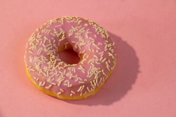 SWEET Donut on a pink background. Sugar, calories, homemade sweets concept FOR SWEET LOVERS