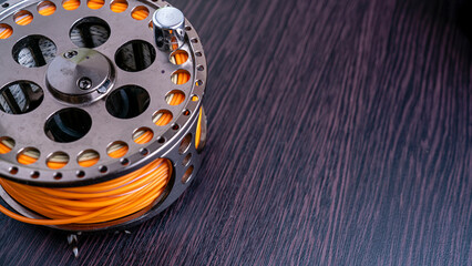 Fly Fishing Reel close up. Top view.
