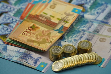 Almaty, Kazakhstan - 04.05.2023 : Coins and banknotes of Kazakhstani tenge are laid out on the table.