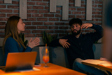 Two people sitting together at the cafe