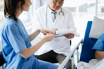 Doctors explaining the symptoms to a patient in a hospital or therapeutic treat client Professional medical service concept..
