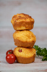 Savory muffin with ham and cheese on blue background, High quality photo