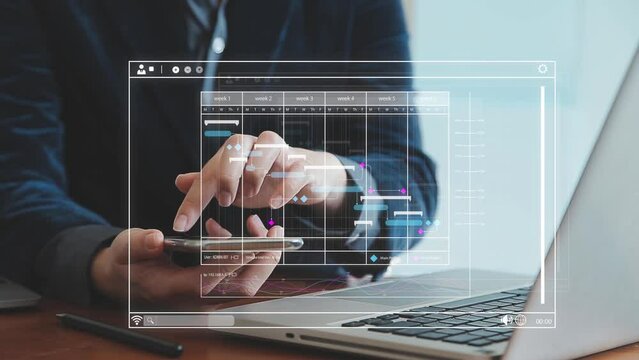 Project manager working with Gantt chart schedule to plan tasks and deliverables. Scheduling activities with a planning software, Corporate strategy for finance, operations, sales, marketing.