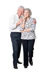 Portrait of beautiful senior couple posing isolated