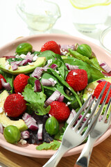 Concept of tasty food, salad with strawberry
