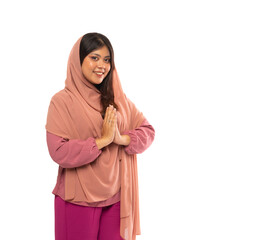 portrait of attractive Asian muslim woman's hand making greeting or welcoming gesture on isolated background with copyspace